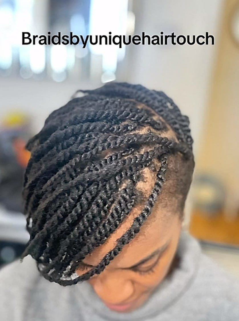 Black woman with soft kinky twists protective hairstyle